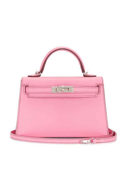 Front view of a structured pink calfskin leather handbag with a top handle, removable shoulder strap, and polished silver-tone turn-lock hardware displayed on a clean white background.
