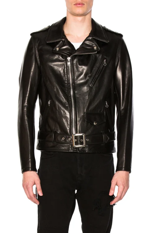 Cropped front studio shot of a model wearing a fully zipped black steerhide moto jacket with the waist belt securely buckled, featuring silver-tone zipper hardware, lapel snaps, and diagonal chest zip pocket.